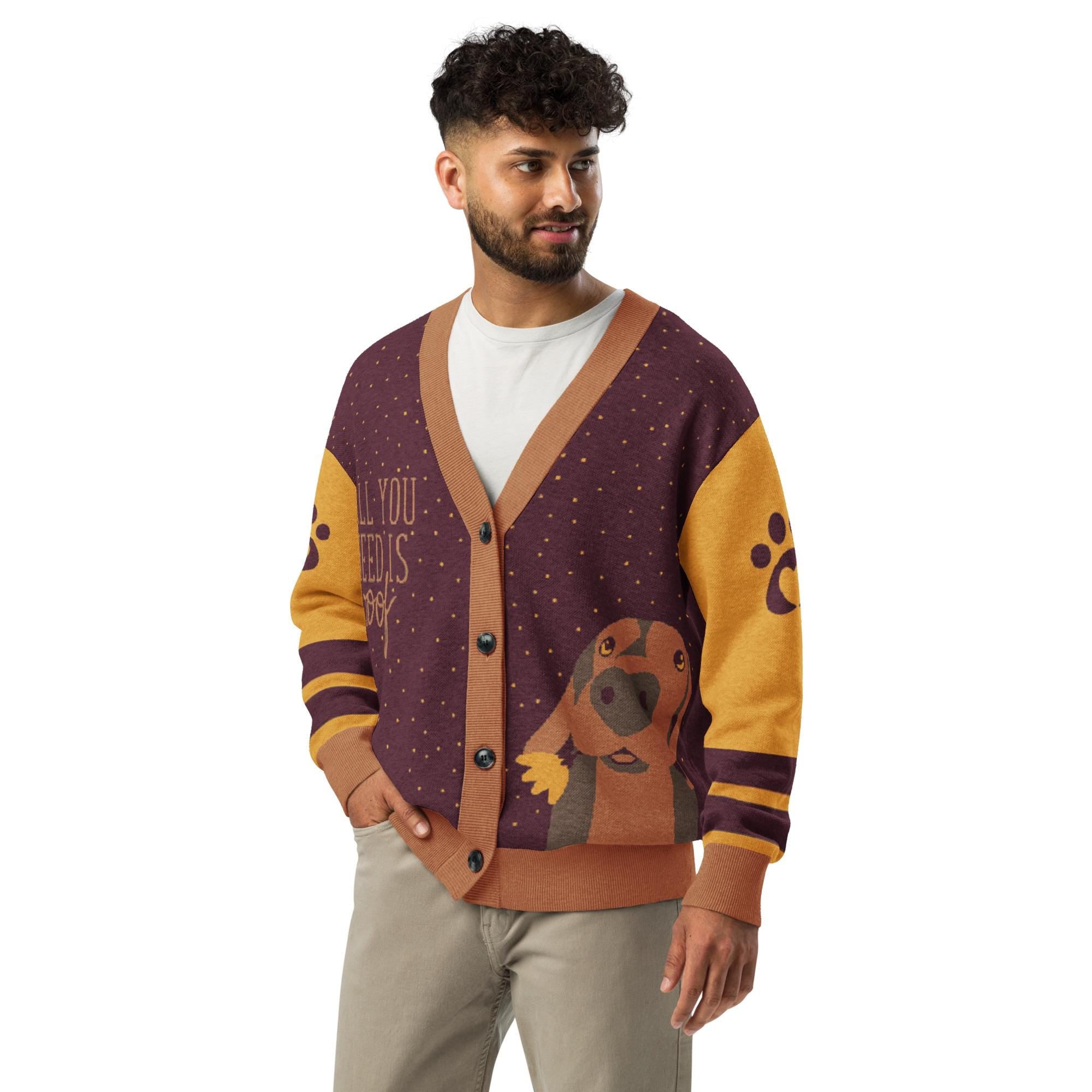 A man wearing a purple and yellow cardigan with a dog design on it.