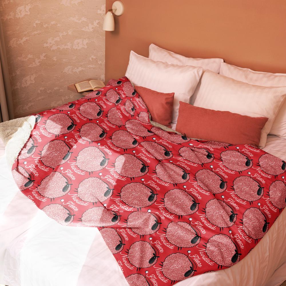 a cozy bedroom scene with a bed covered in a red and white patterned blanket featuring a repeating design of sheep. The bed is adorned with white pillows and a white comforter, creating a warm and inviting atmosphere.