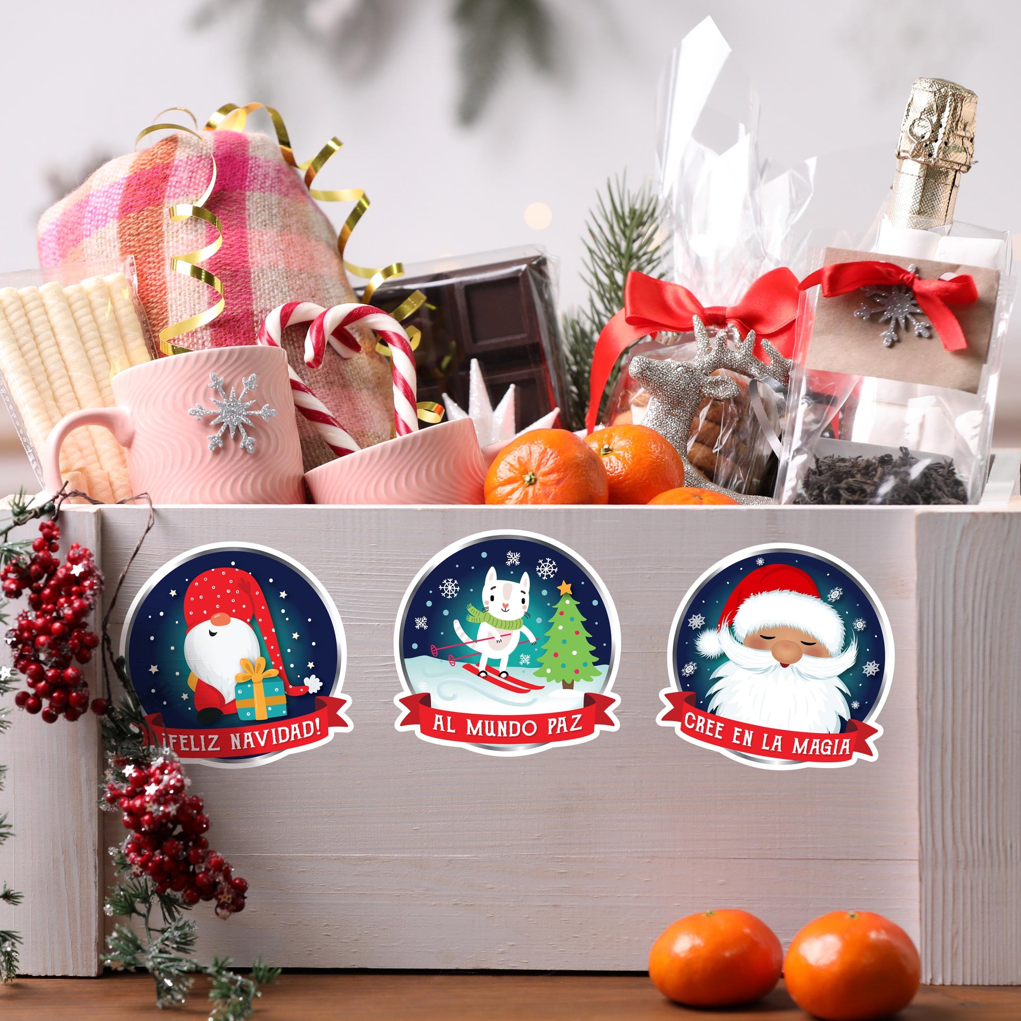 A festive gift basket filled with various holiday-themed items, including a bottle of champagne, oranges, candy canes, and a Santa Claus sticker.
