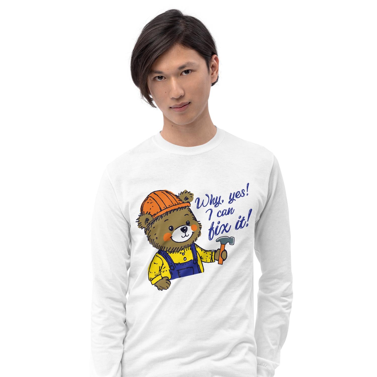 A young man wearing a white long-sleeved shirt with a cartoon image of a bear wearing a hard hat and holding a hammer, along with the text "Why, yes! I can fix it!"
