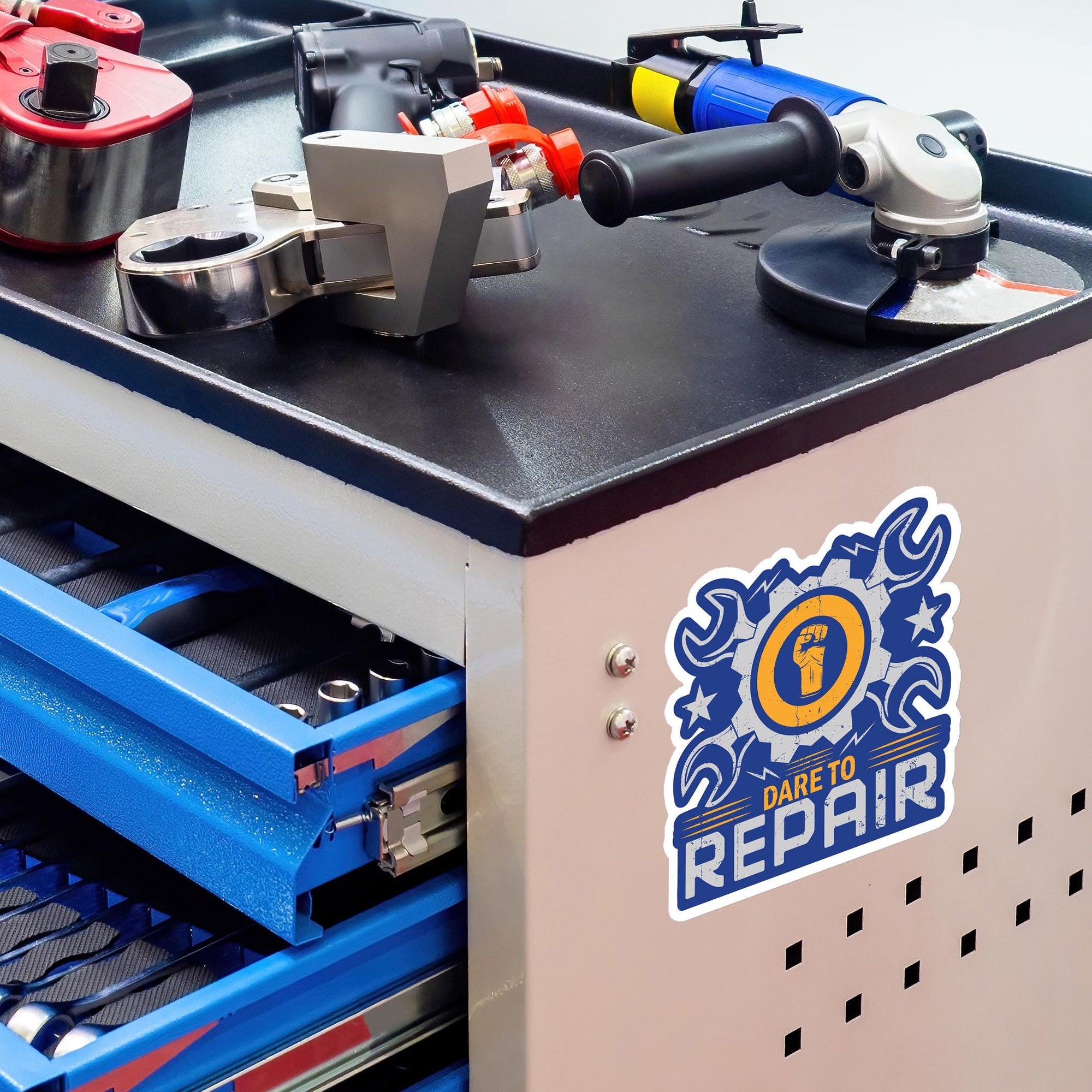a variety of tools and equipment, including a drill, a wrench, and a grinding wheel, all arranged on a workbench.