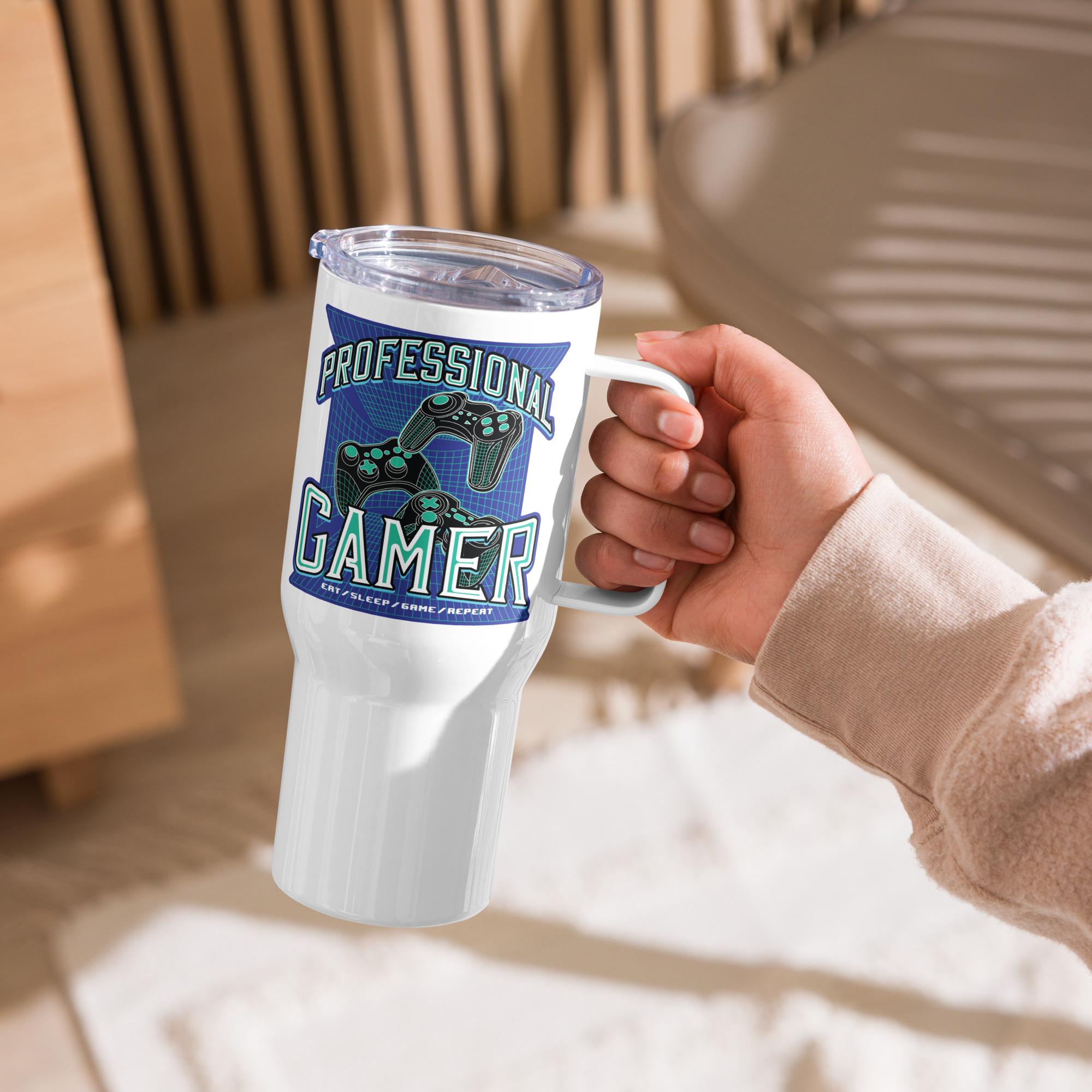 A person's hand holding a white tumbler mug with a graphic design on it.