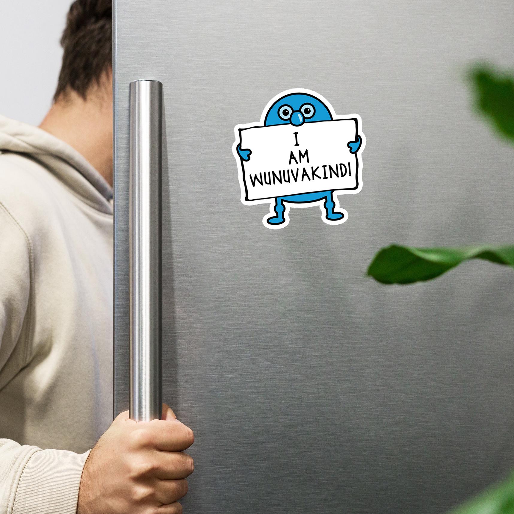 A person is holding a metal handle of a refrigerator with a sticker of a blue cartoon character holding a sign that says "I AM WUNUVAKINDI".