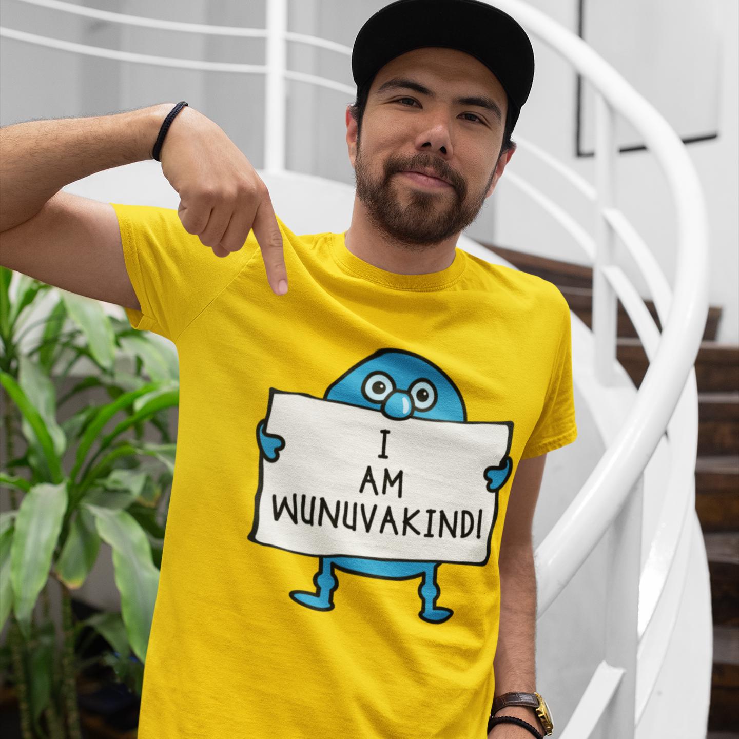 A man wearing a yellow t-shirt with a cartoon character holding a sign that says "I AM WUNUVAKINDI" and pointing at the sign.