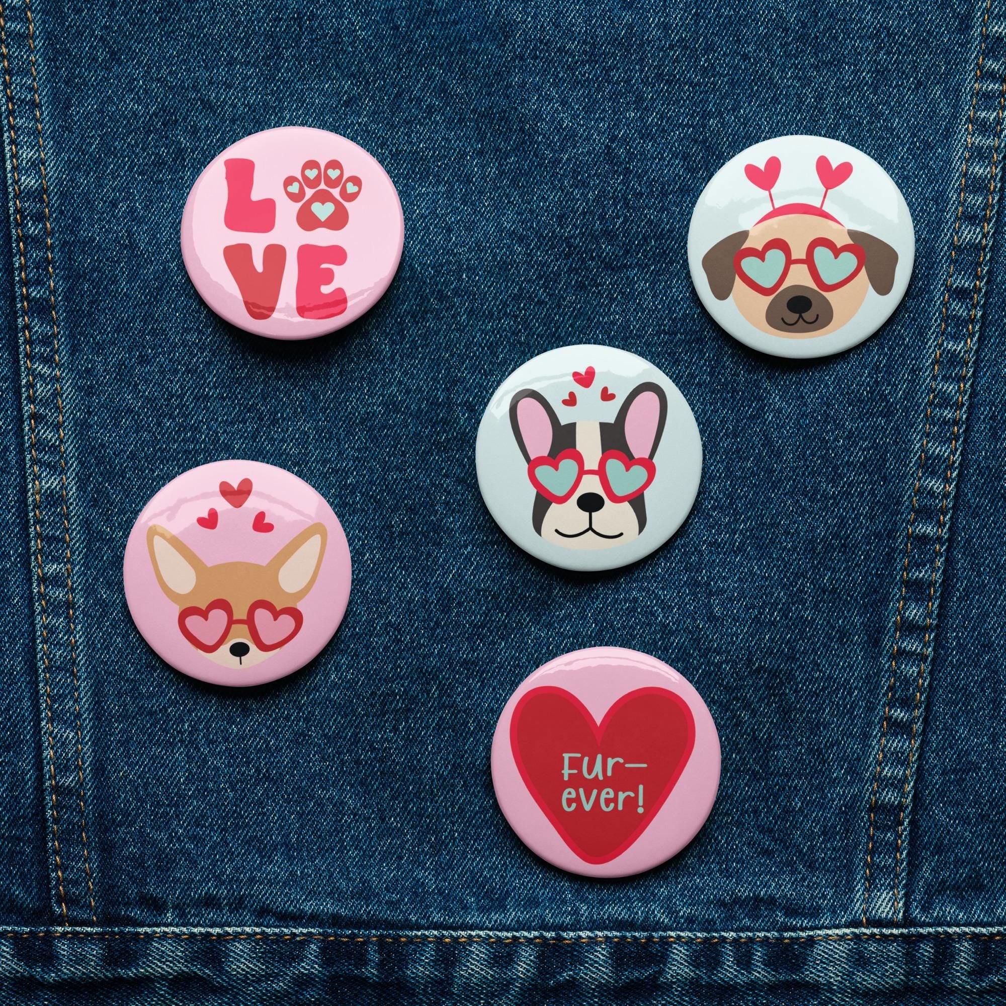 five round badges with various dog-themed designs, including a dog wearing sunglasses and a heart, a dog with a paw print, a dog with a heart, a dog with a heart and the word "love", and a dog with a heart and the word " Fur-ever!".